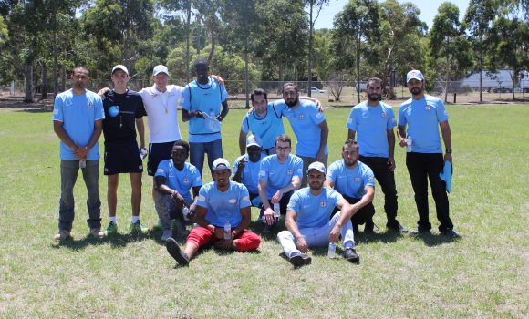 City Start participants with Melbourne City FC coaches after their first football training session.