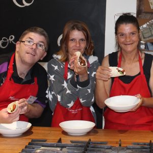 Participants showing off their cooking skills at Jamie's Ministry of Food in Geelong.