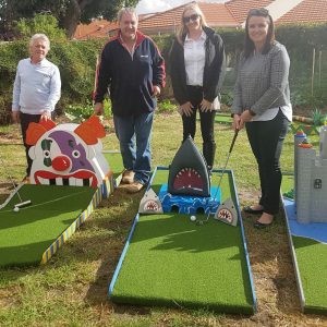 MatchWorks, Envision Employment Services and MAX Solutions team members with the Peninsula Sandtrap mini golf course.
