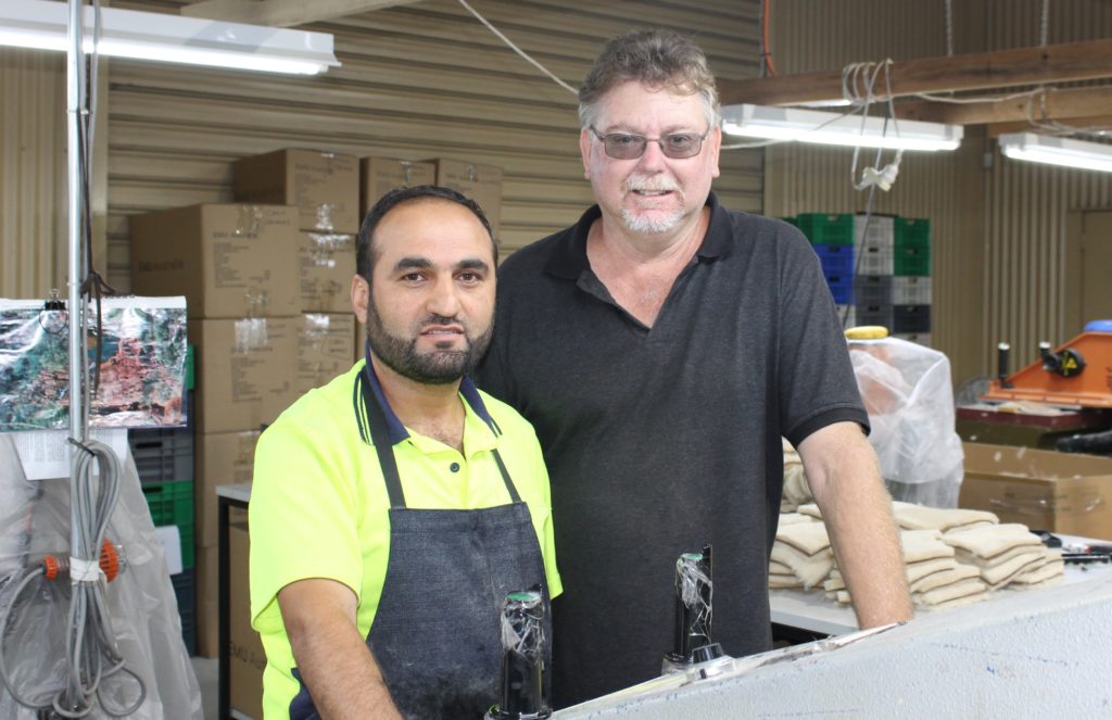Corio job seeker Anas and EMU Australia factory manager Steve Maul.