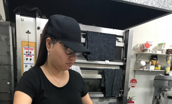 Lady working in commercial kitchen