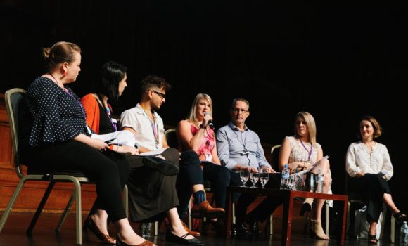 Group of people having a panel discussion