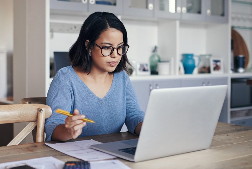 Woman applying for job at home on computer