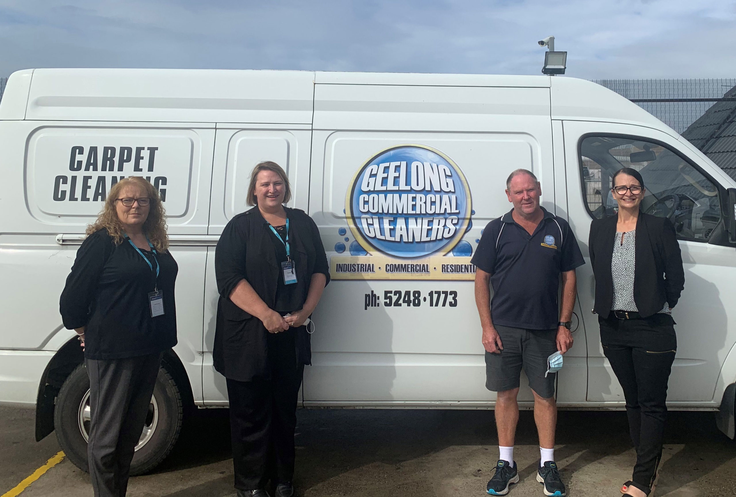 Group of employees standing next to Geelong Commercial Cleaners van